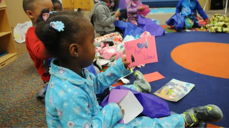 kids receiving care kits