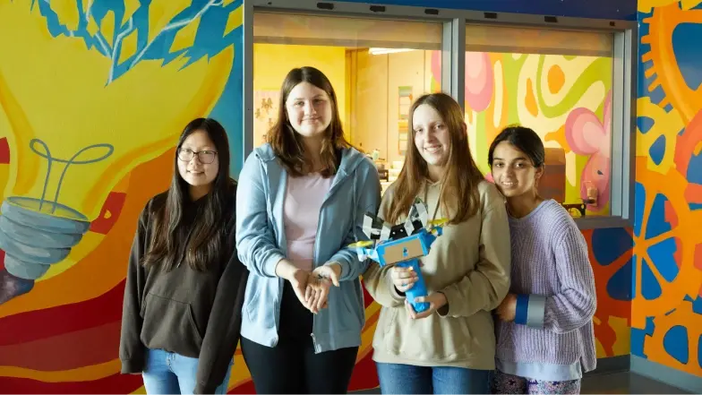 students who developed a nonharmful spider-trapping device