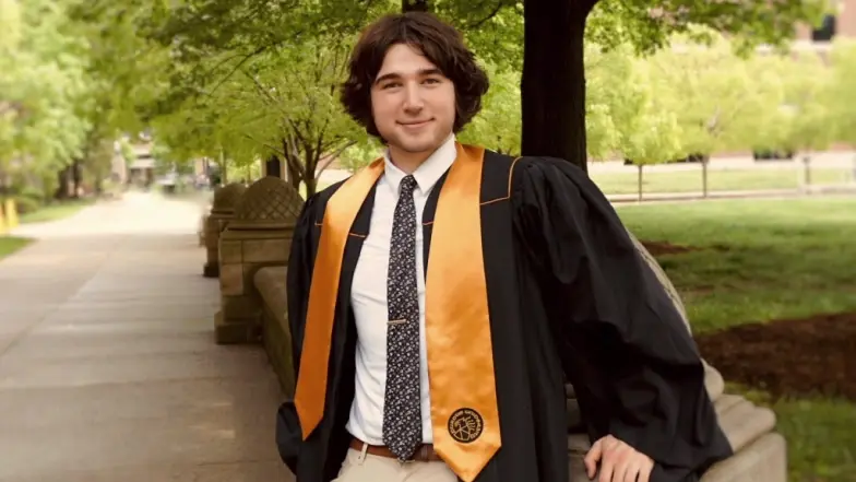 student wearing graduation gown