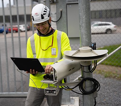 An engineer calibrates a camera that will help automate a gate using Visy’s AI-based vision technology